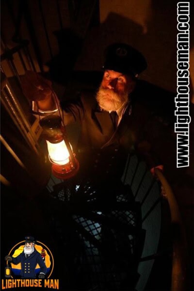 Lighthouse Keeper in stairwell with Lantern